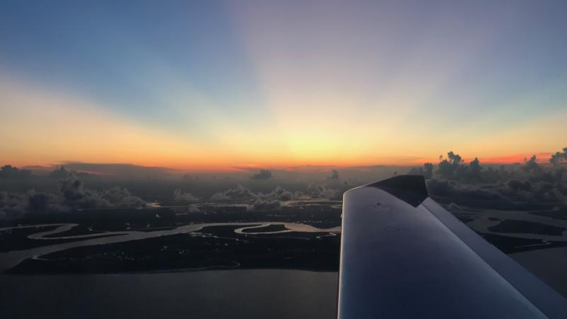 sunset and wing of plane