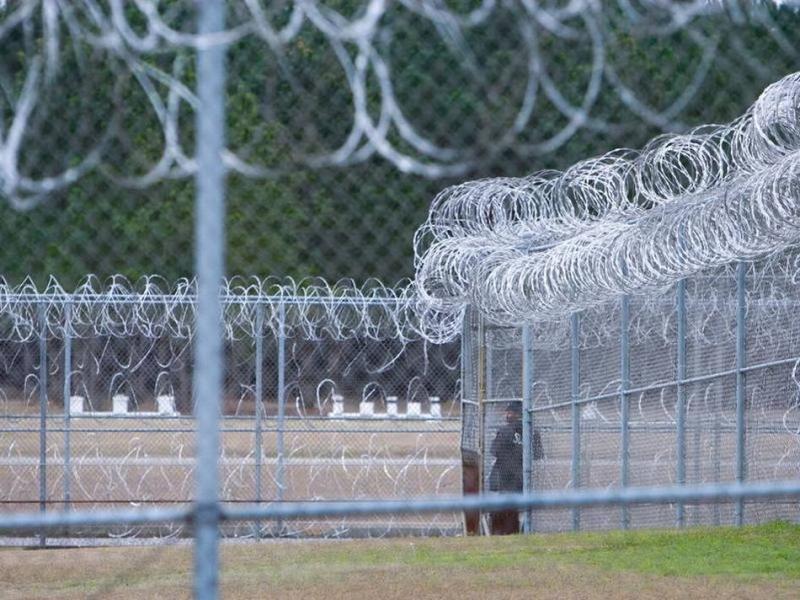 A prison fence with barbed wire